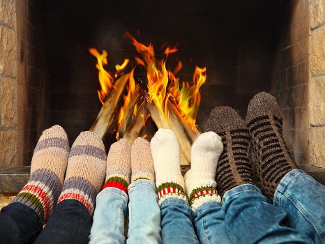 Feet warming near the fireplace